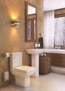 Pure lifestyle bathroom suite including sink on full pedestal and toilet with cistern in a modern bathroom setting.